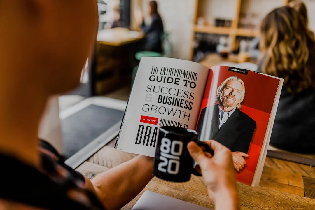 A man and woman engaged in a business meeting discussing SEO strategy in a cozy cafe setting.